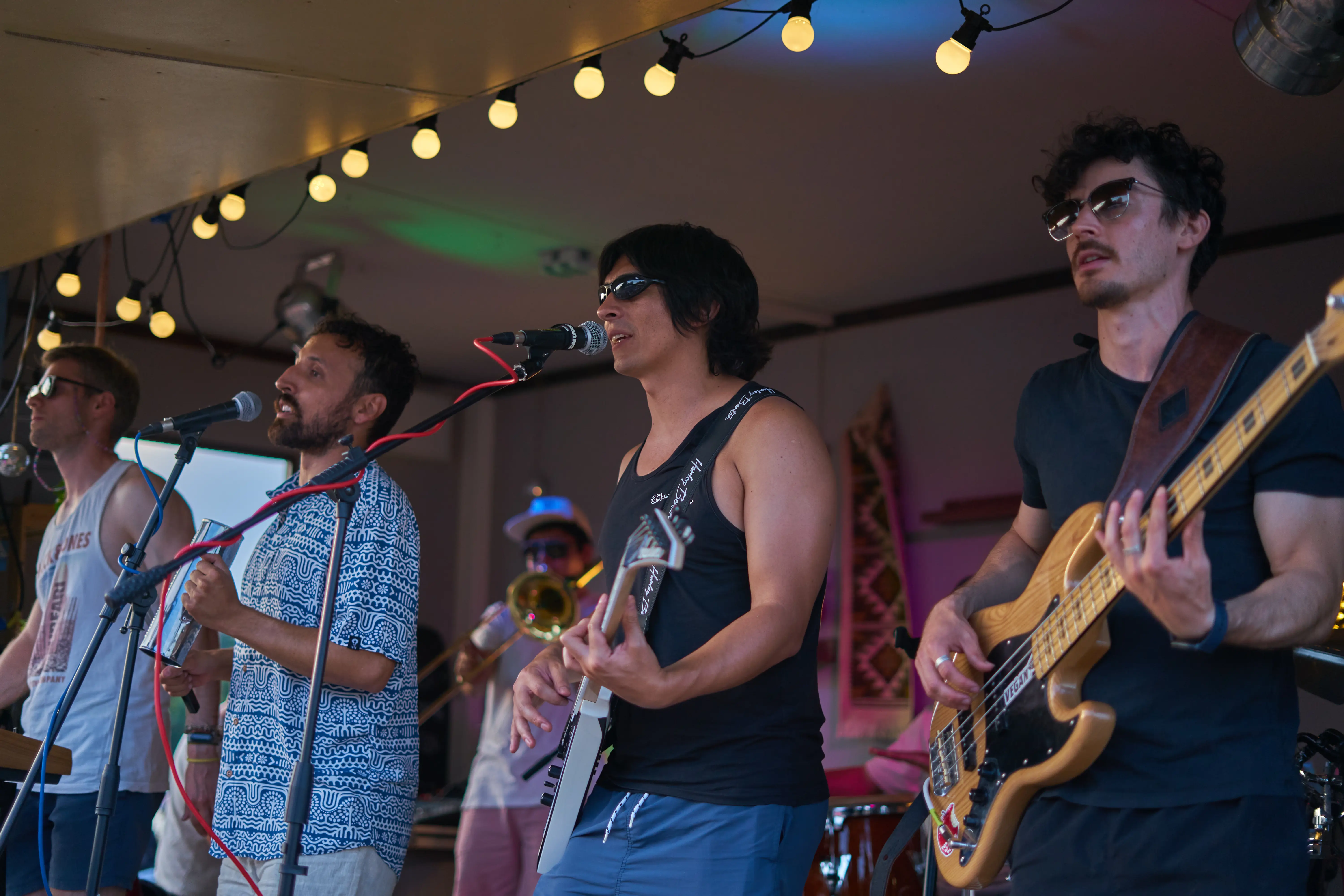 Band playing on a sunny stage